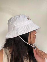 Load image into Gallery viewer, Unisex: Unf*ck The World Bucket Hat in White w gold

